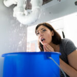 Woman,With,Emergency,Plumbing,Sink,Leak,Problem